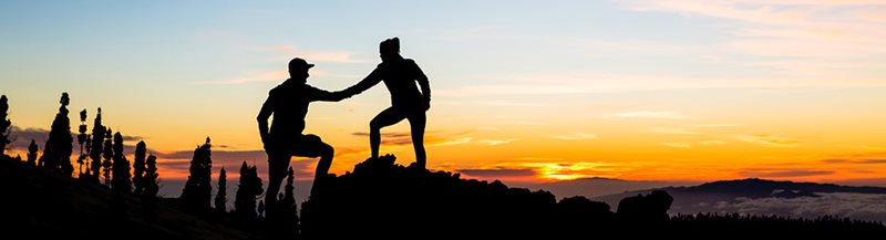image of a person helping another