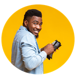 Smiling male putting money in his wallet